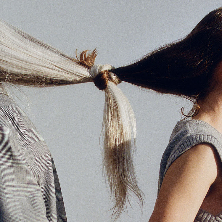 Back of model's head and neck with short light coloured hair